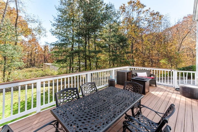 wooden deck featuring outdoor dining space