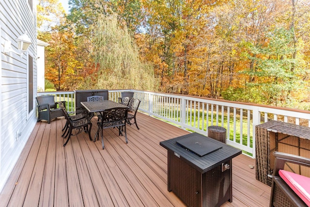 wooden terrace with outdoor dining space