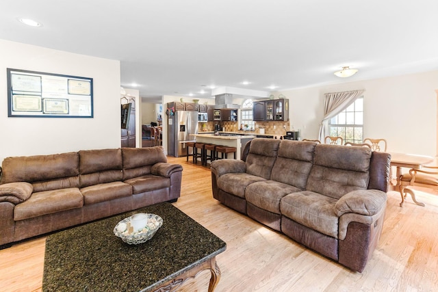 living room featuring recessed lighting and light wood-style flooring