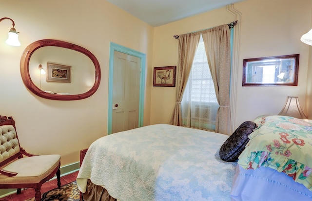 bedroom with hardwood / wood-style flooring