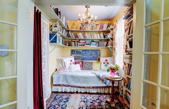 living area featuring a notable chandelier