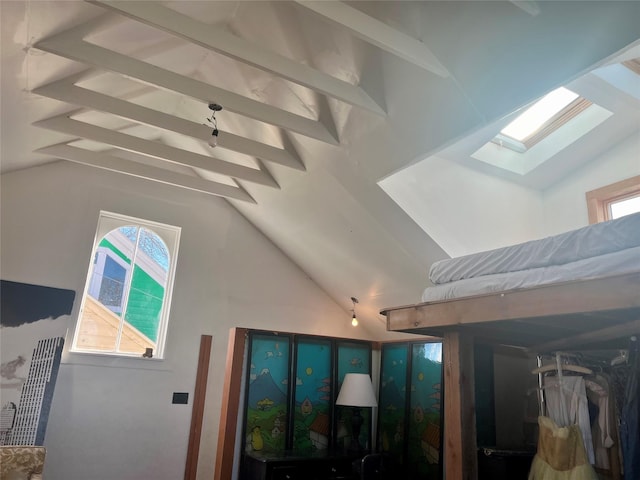 room details featuring a skylight and beamed ceiling