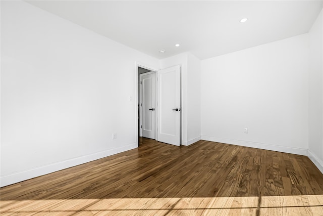 unfurnished room featuring dark hardwood / wood-style floors