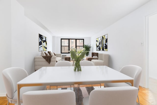 dining room with light parquet floors