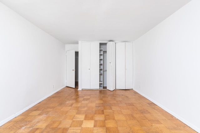 40 Brighton 1st Rd Unit 3J, Brooklyn, NY 11235 - unfurnished bedroom featuring baseboards and multiple closets