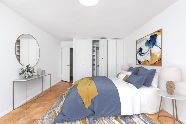 bedroom featuring light parquet floors