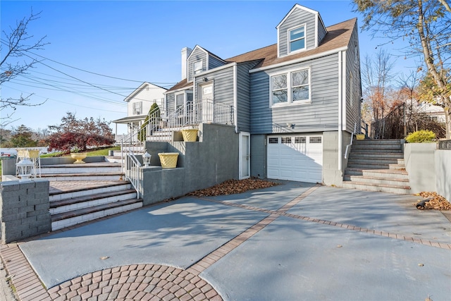 view of side of property with a garage