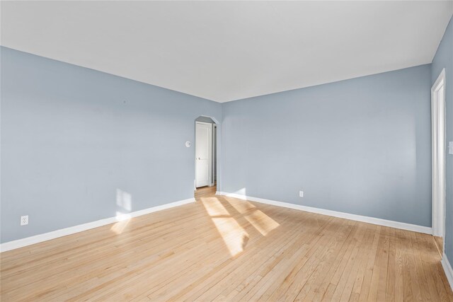 spare room featuring light hardwood / wood-style flooring