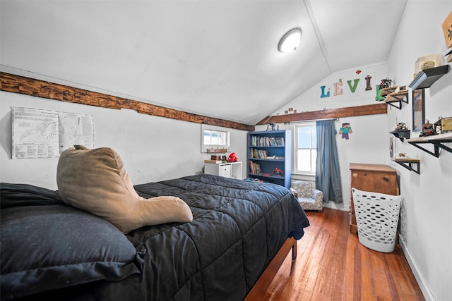 bedroom with hardwood / wood-style floors and vaulted ceiling