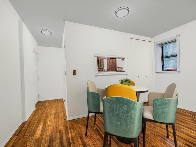 dining space featuring wood-type flooring