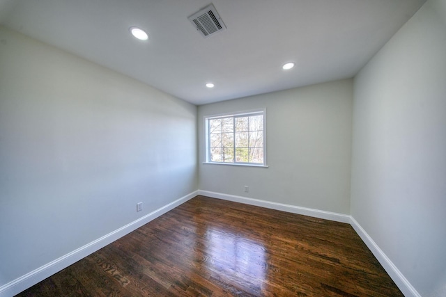 empty room featuring dark hardwood / wood-style floors