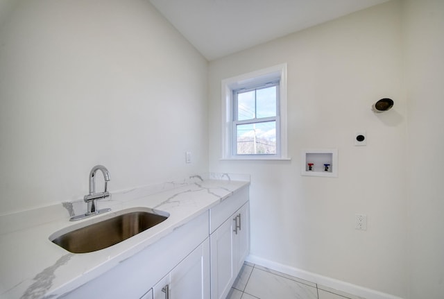 washroom featuring cabinets, hookup for a washing machine, electric dryer hookup, sink, and light tile patterned flooring