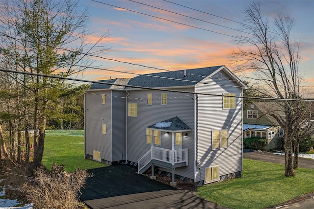 view of front of home with a lawn