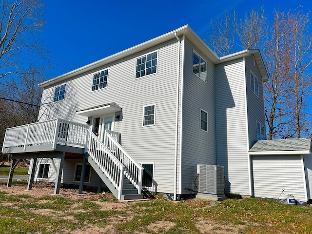 back of house featuring a deck