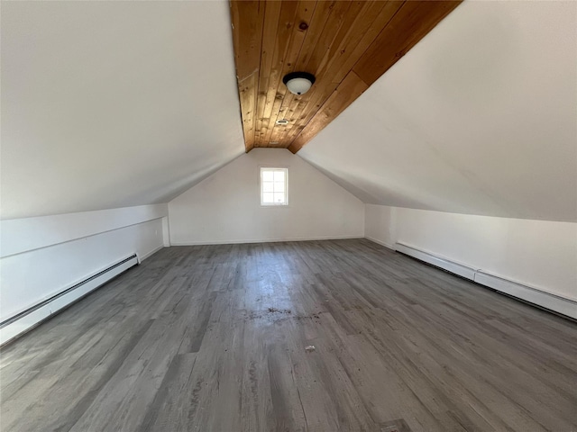 bonus room with a baseboard heating unit, hardwood / wood-style flooring, vaulted ceiling, and wooden ceiling