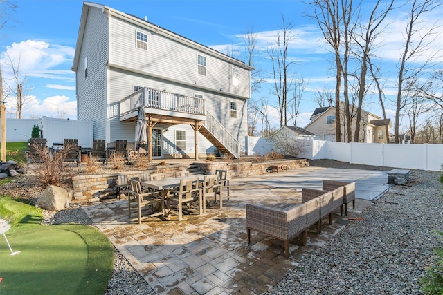 rear view of house with a patio