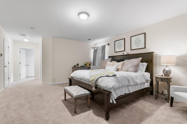 bedroom with light colored carpet