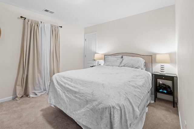 bedroom with light carpet