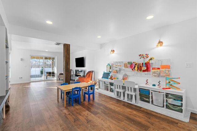 playroom with dark hardwood / wood-style flooring and ornate columns