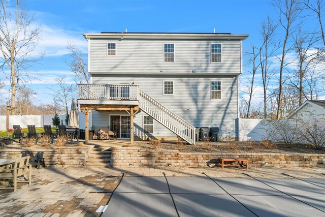 rear view of property with a patio area and a deck