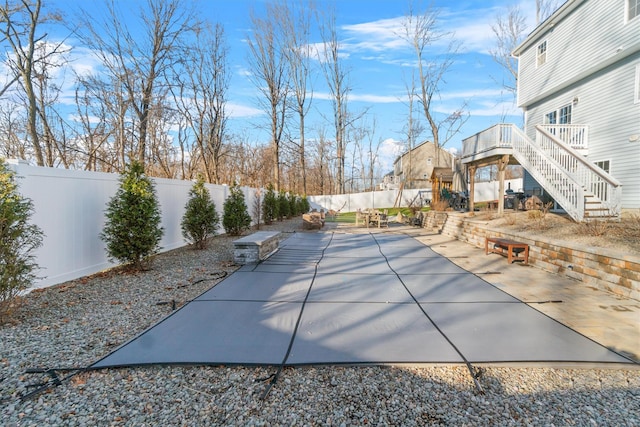 view of pool with a patio and a deck