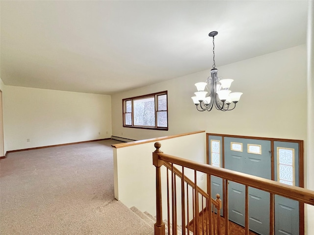 interior space with a notable chandelier, carpet floors, and a baseboard heating unit