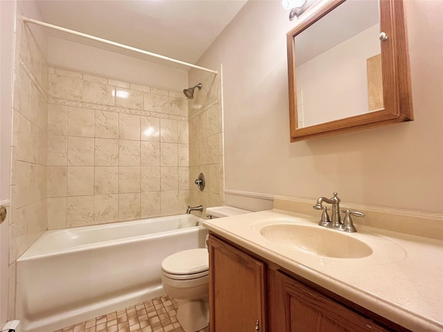 full bathroom with tile patterned flooring, vanity, toilet, and tiled shower / bath combo