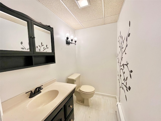 bathroom featuring vanity, a baseboard radiator, and toilet