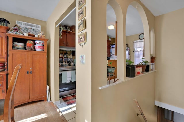 hall with light hardwood / wood-style flooring