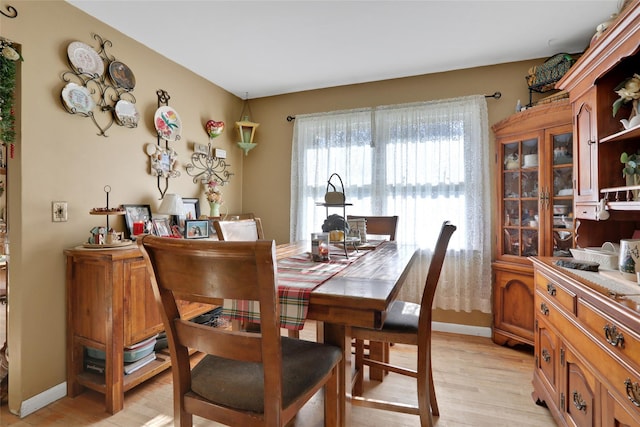 dining area with light wood-type flooring