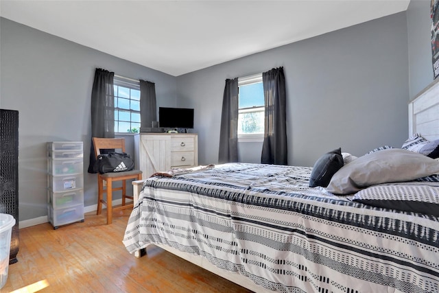 bedroom with light hardwood / wood-style floors