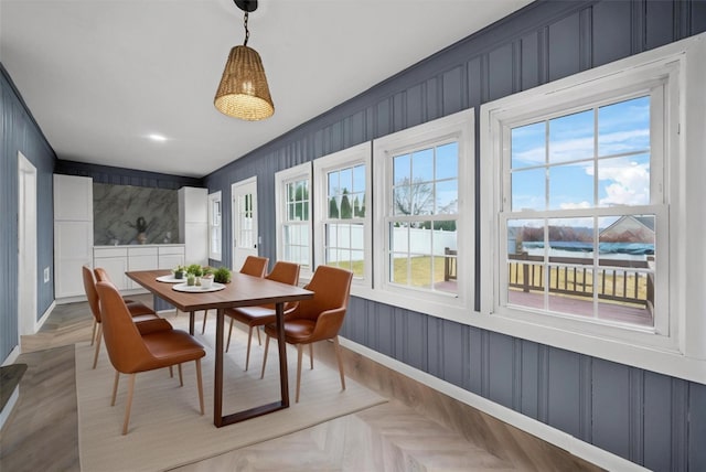dining space featuring baseboards