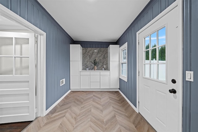 entryway featuring baseboards