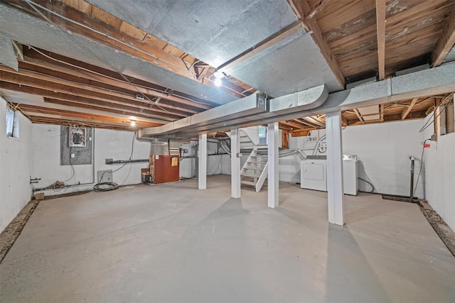 basement with stairway and independent washer and dryer