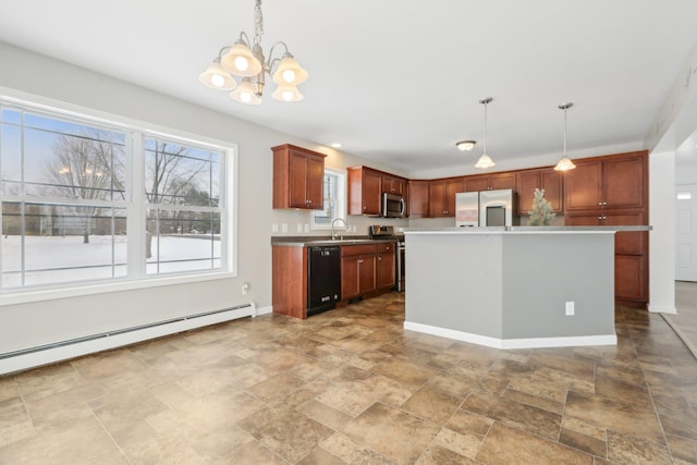 kitchen featuring stainless steel appliances, a kitchen island, a baseboard heating unit, and hanging light fixtures