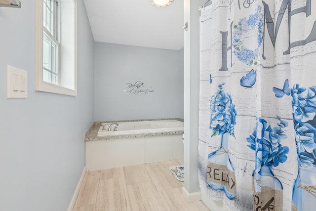 bathroom with a tub