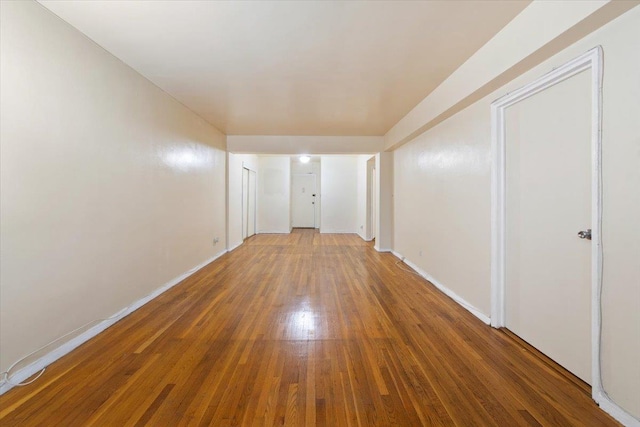 empty room featuring hardwood / wood-style flooring