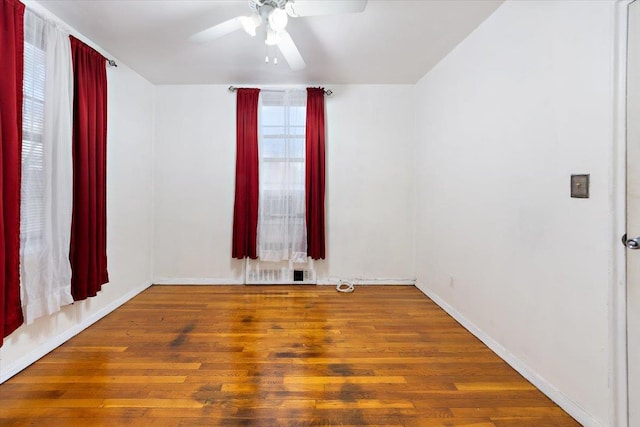 spare room featuring hardwood / wood-style flooring and ceiling fan