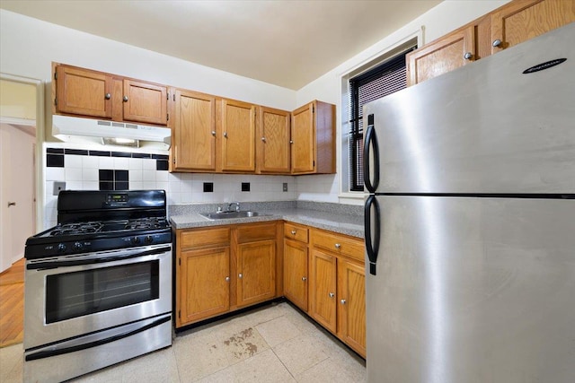 kitchen featuring decorative backsplash, sink, and stainless steel appliances