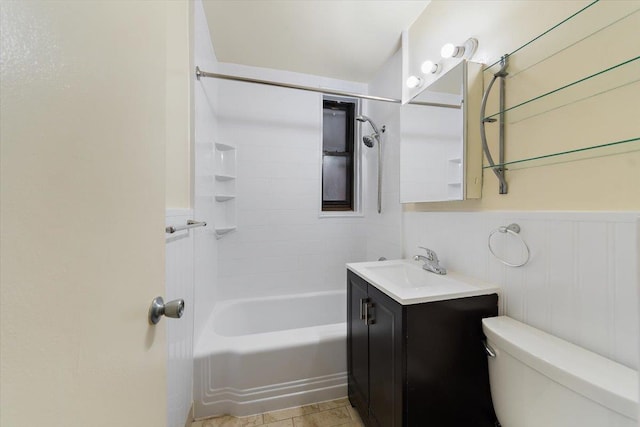 full bathroom with vanity, toilet, and tiled shower / bath