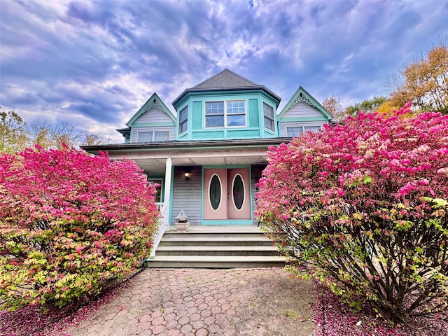 victorian-style house with a porch