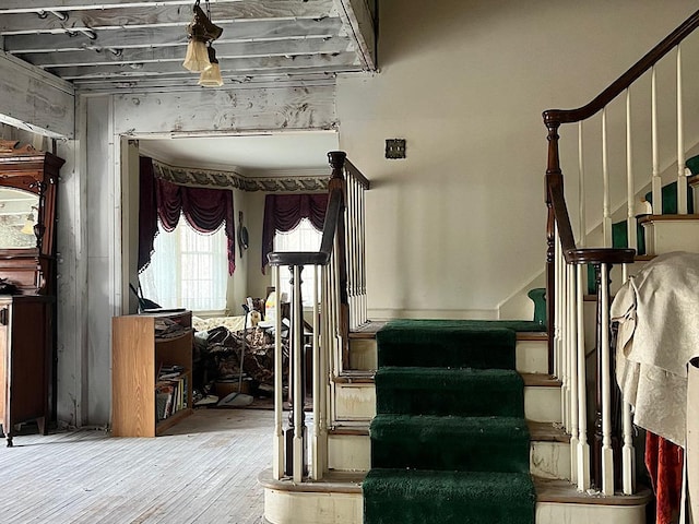 stairway with wood-type flooring