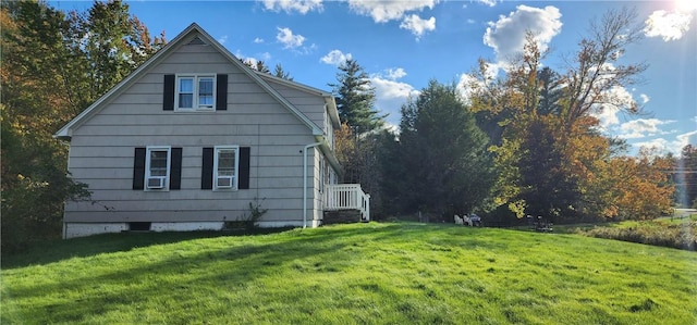 view of home's exterior with a lawn