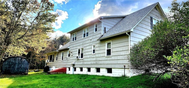 view of side of home with a lawn