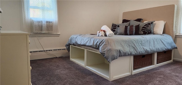 bedroom featuring dark carpet and baseboard heating