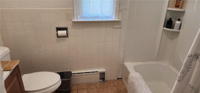 full bathroom with tile patterned flooring, toilet, tile walls, and a baseboard radiator