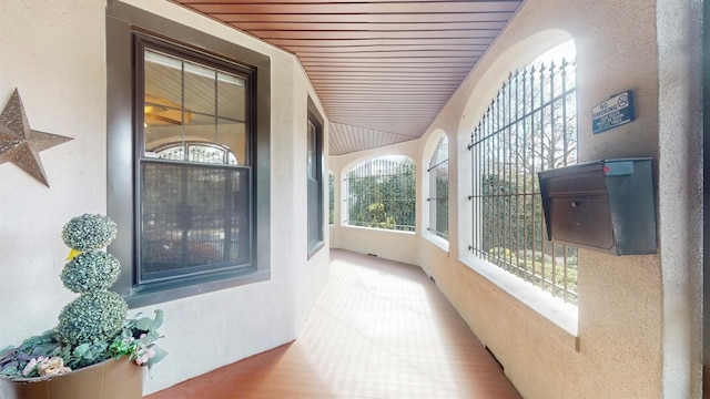 interior space featuring hardwood / wood-style floors and wood ceiling