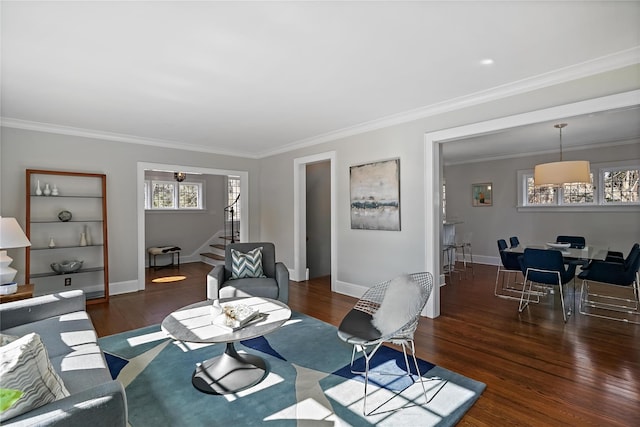 living room with ornamental molding and dark hardwood / wood-style floors