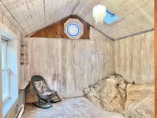 interior space with a skylight and a baseboard heating unit