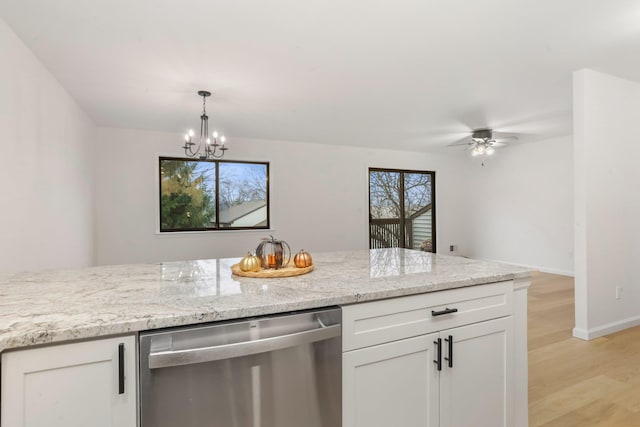 kitchen with dishwasher, white cabinets, ceiling fan with notable chandelier, and light hardwood / wood-style flooring